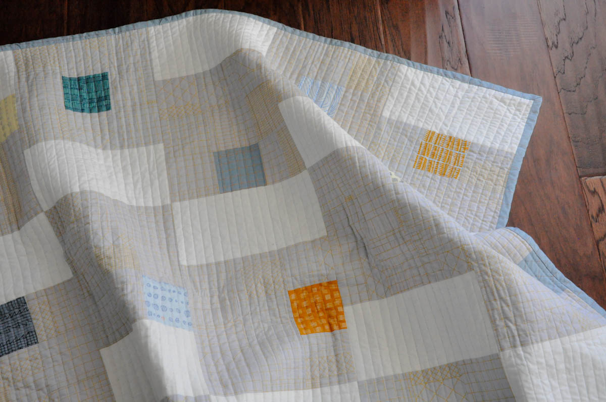 A modern quilt inspired by a tile floor telafante