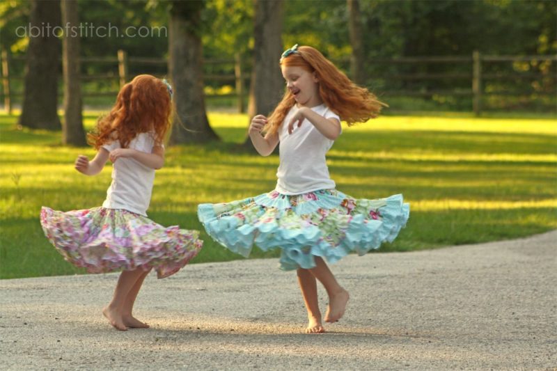 little girls dancing in ruffle skirt