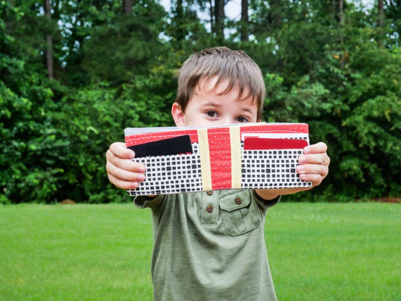 boy holding wallet he made